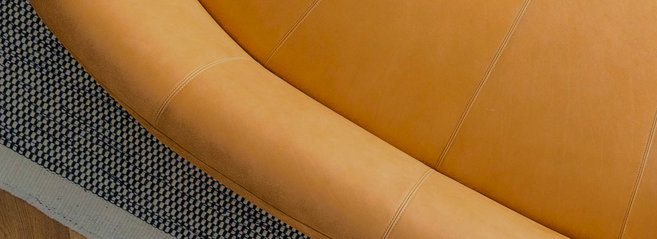 top down view of a sleek tan leather sofa